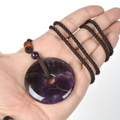 Justinstones Amethyst Peace Donut Pendant worn on the neck for subtle style.