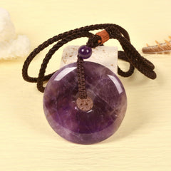 Justinstones Amethyst Peace Donut Pendant on braided cord for versatile wear.