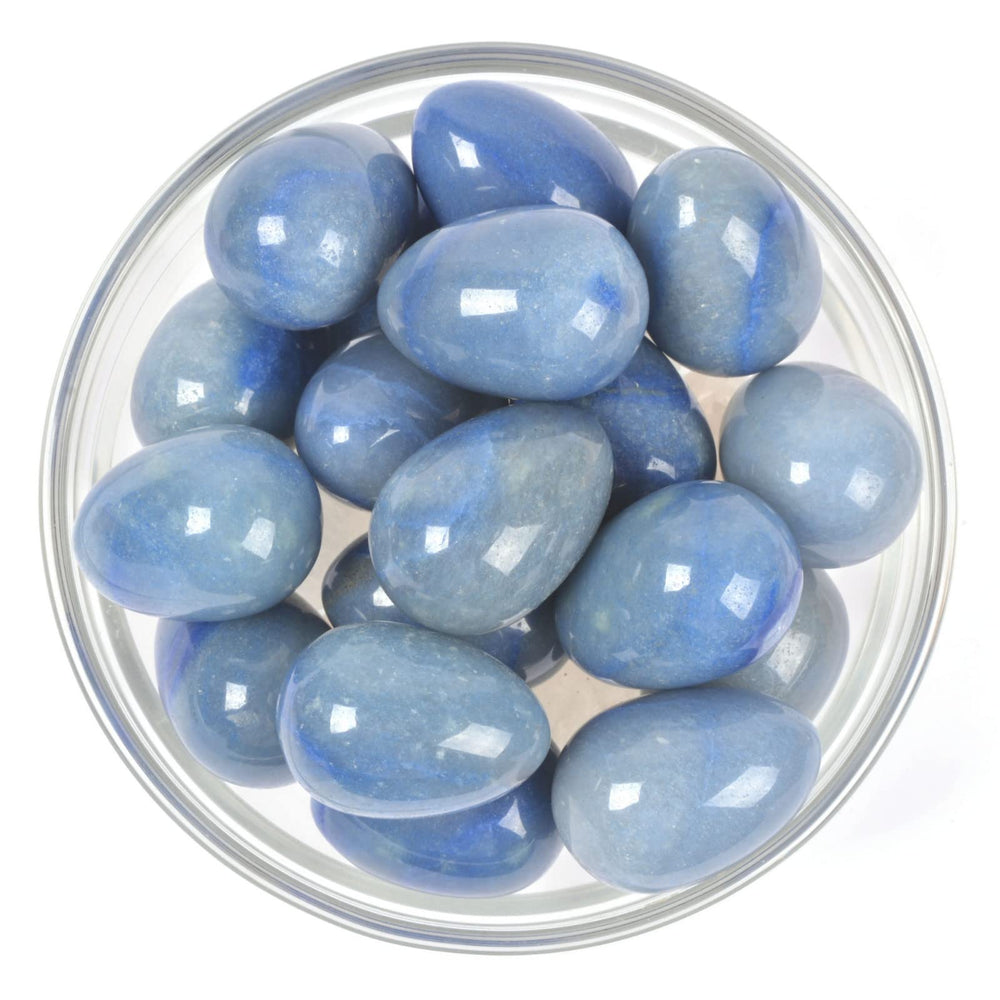 Justinstones blue aventurine egg crystal on altar or shelf for peaceful ambiance.