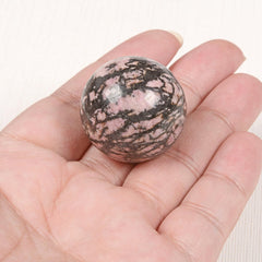 Justinstones rhodonite display scene enhances desk ambiance and calm energy.