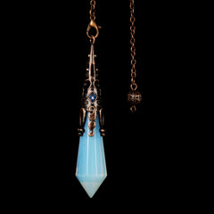 Justinstones Opalite pendulum closeup highlights facets for precise divination sessions.