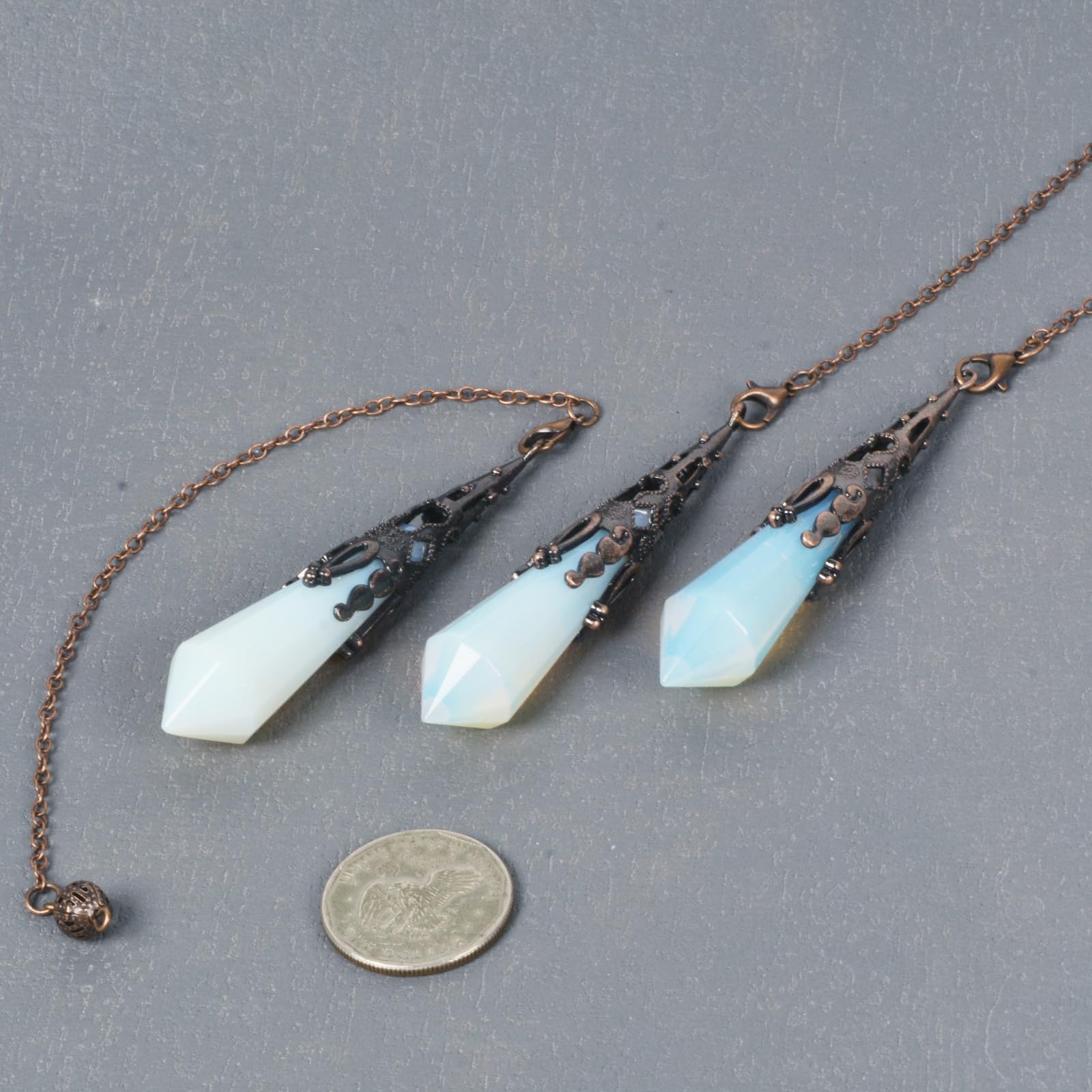 Justinstones Opalite pendulum with chain shown for steady meditation practice.