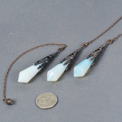 Justinstones Opalite pendulum with chain shown for steady meditation practice.
