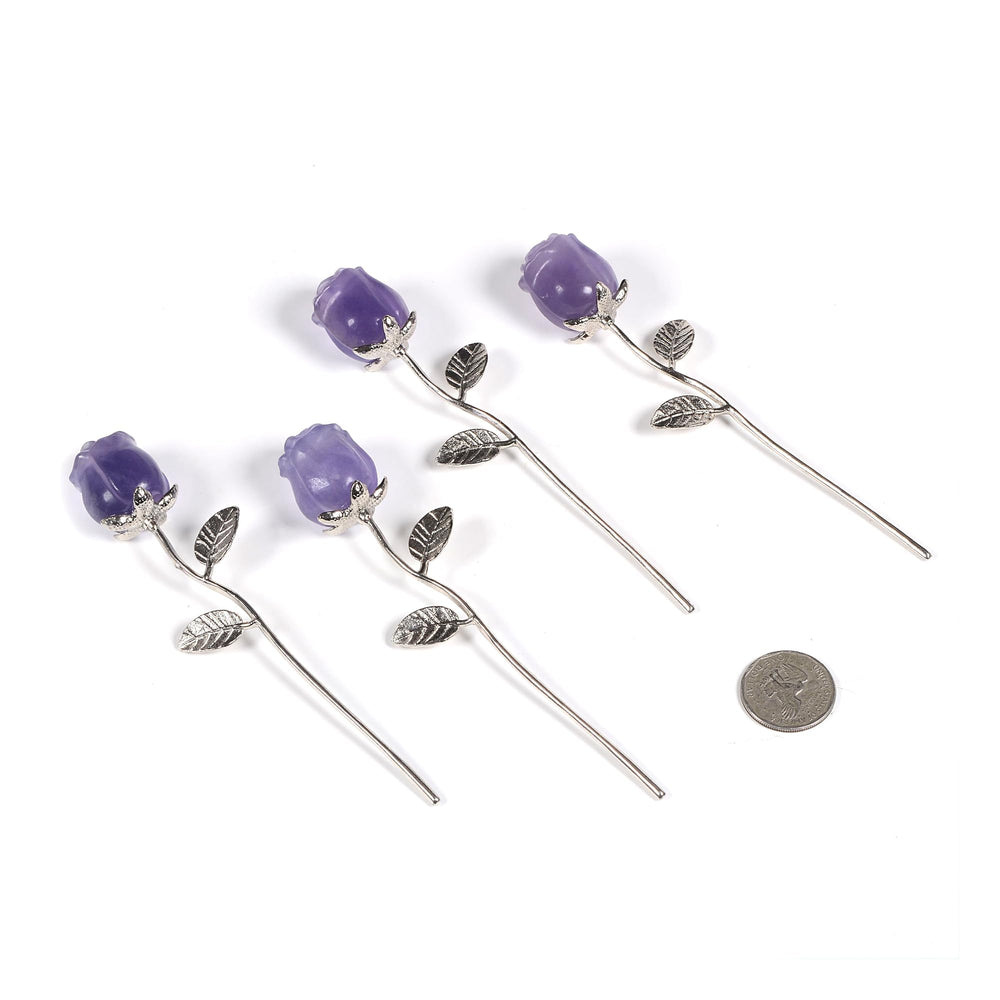 Justinstones Purple Fluorite Rose displayed on a desk enhances ambient room decor.