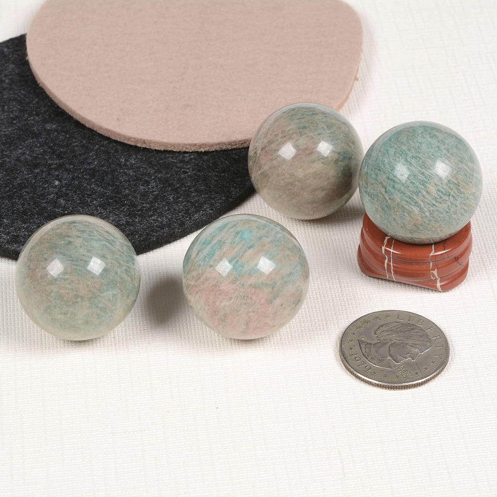 Justinstones red jasper stand elevates the sphere for sturdy display and feng shui.