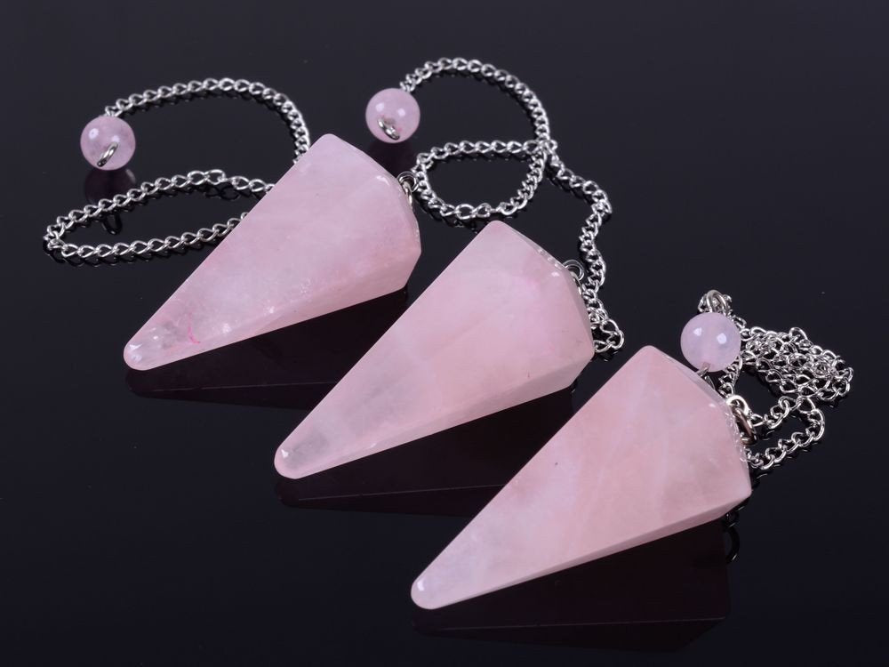 Justinstones Reiki chakra pendant, rose quartz glow enhances grounding during meditation.
