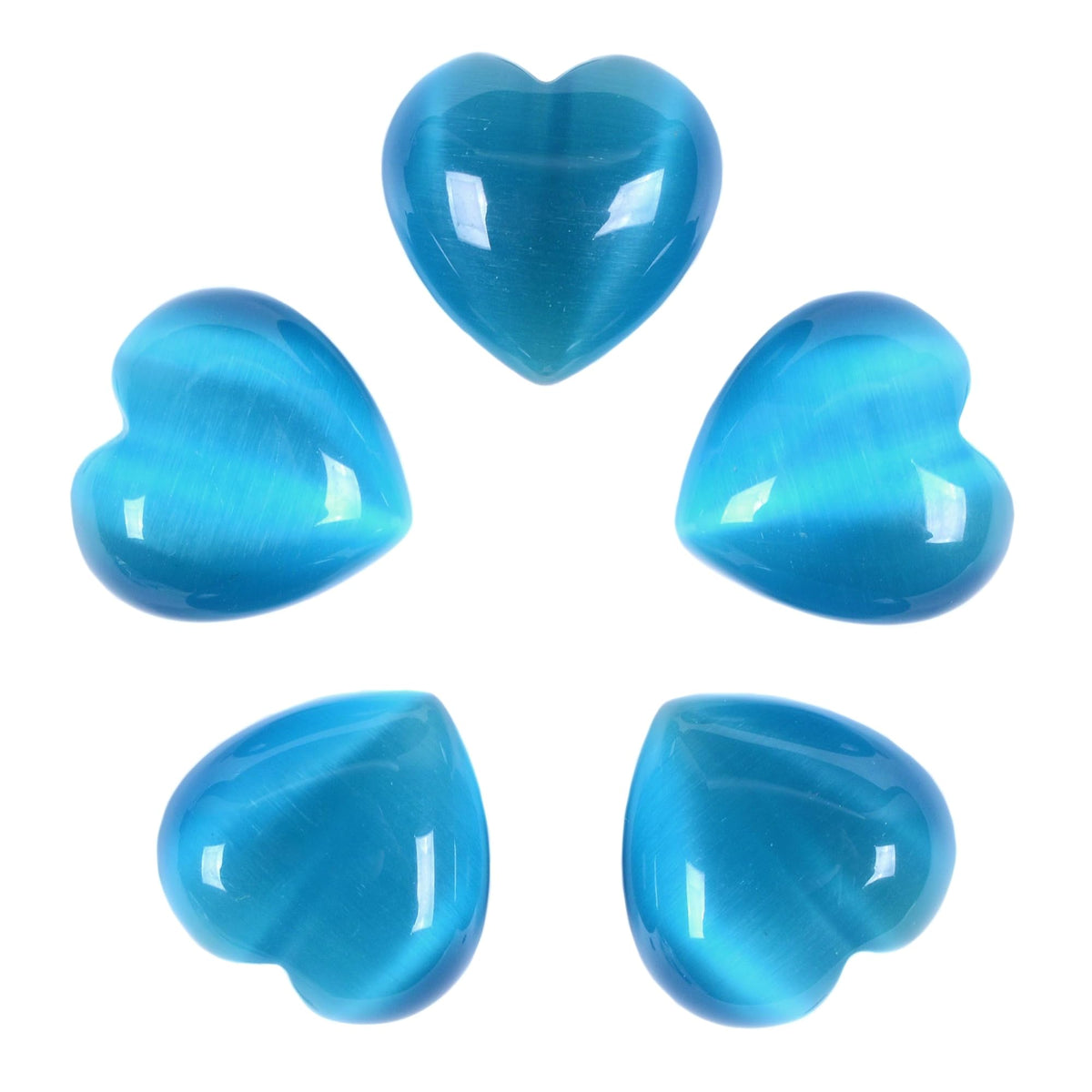 Justinstones sky blue cat's eye heart stone held for chakra balancing