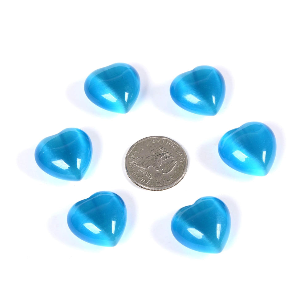 Justinstones sky blue cat's eye heart crystal reflecting light during meditation