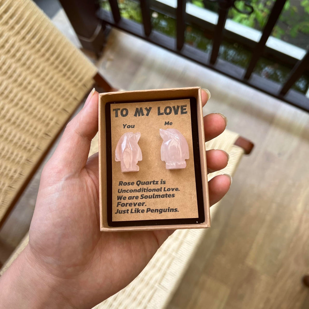 Jvuessieye Penguin couple statue symbolizes harmony for anniversaries.