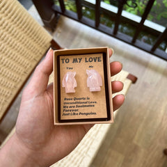 Jvuessieye Penguin couple statue symbolizes harmony for anniversaries.
