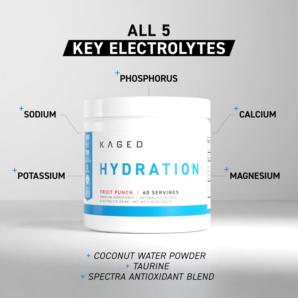 Kaged HydraCharge pink lemonade powder dissolving in a glass of water.