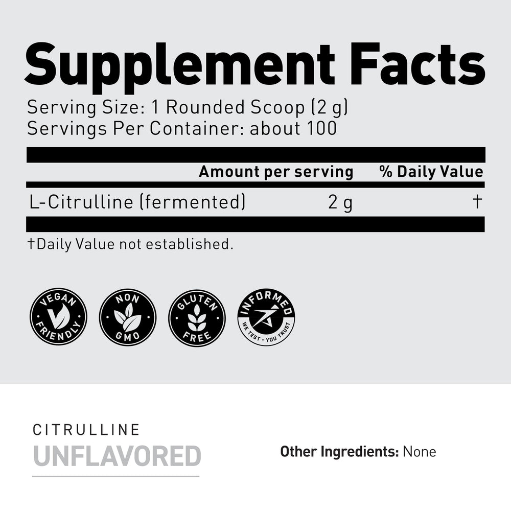 Measuring scoop with Kaged L-Citrulline powder ready for pre-workout dose.