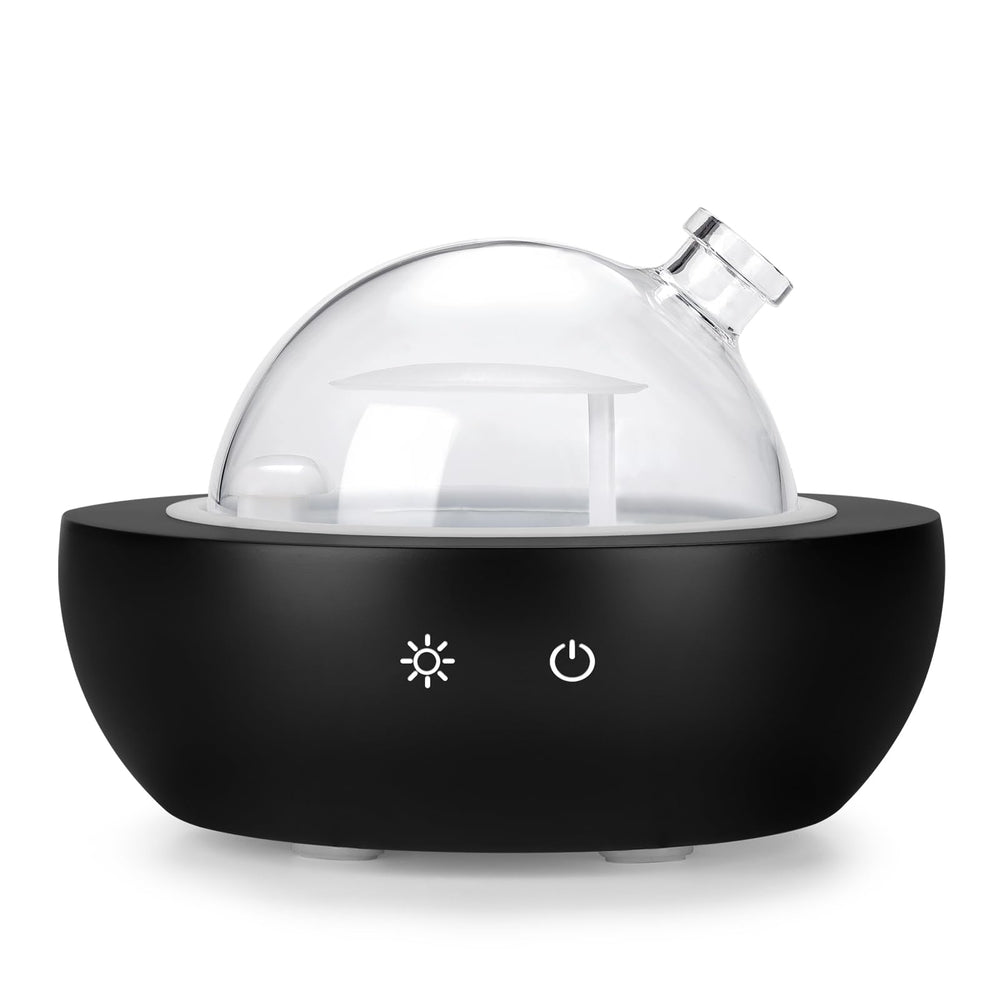 Kakoda glass diffuser with real wood base enhances any room ambiance.