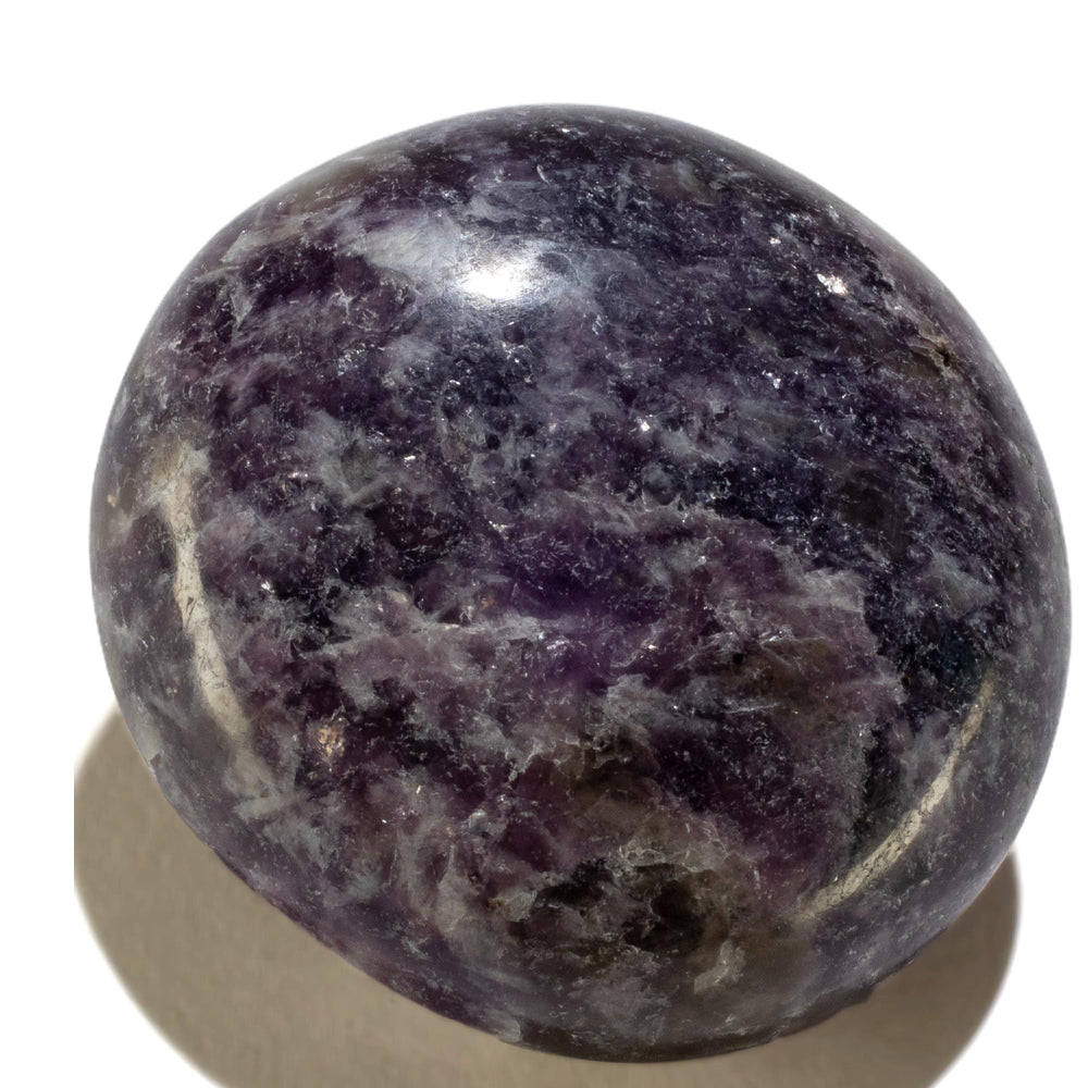 KALIFANO Lepidolite palm stone closeup showing lavender tones and calming energy