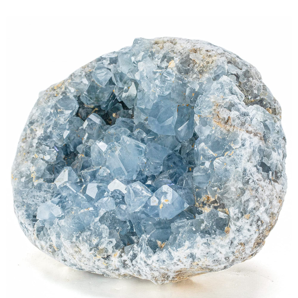 Kalifano raw Celestite geode closeup showcases calming blue tones for serene spaces.