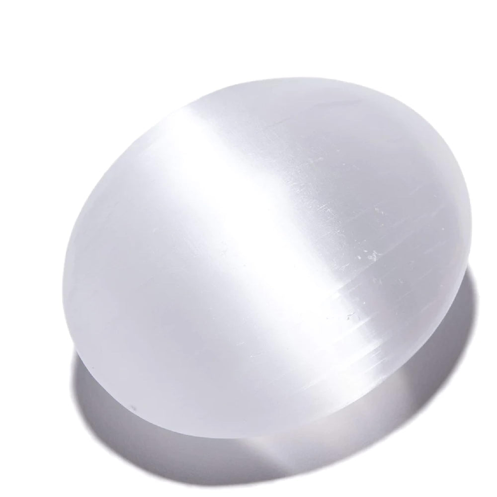 Kalifano selenite palm stone close-up highlighting its smooth surface and calming energy