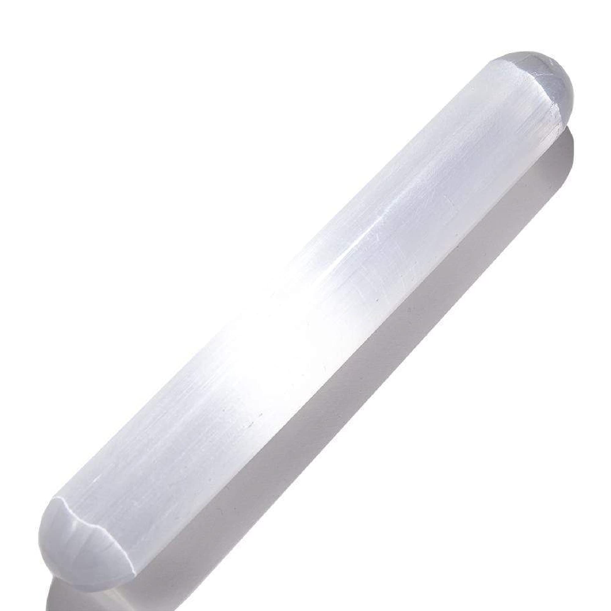Kalifano selenite wand held in hand showing calming, cleansing energy.