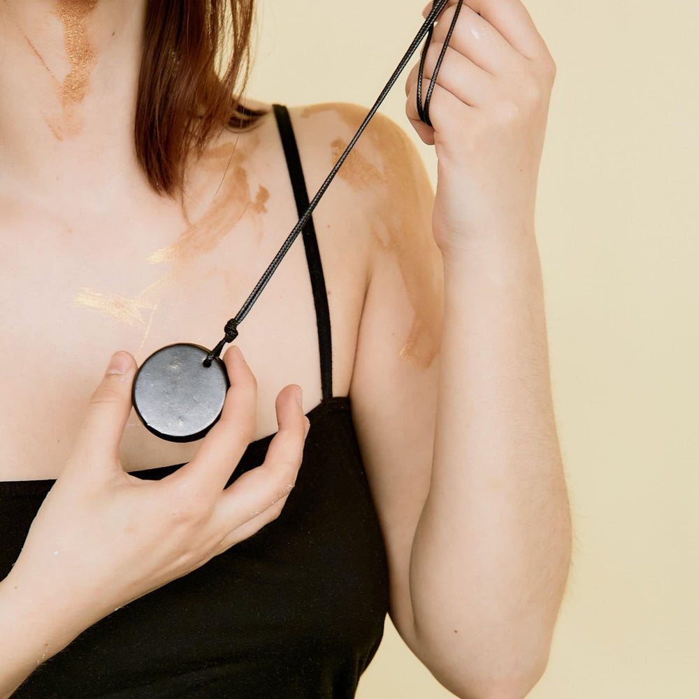 Karelian Heritage defender shield concept shown with the necklace for energy protection