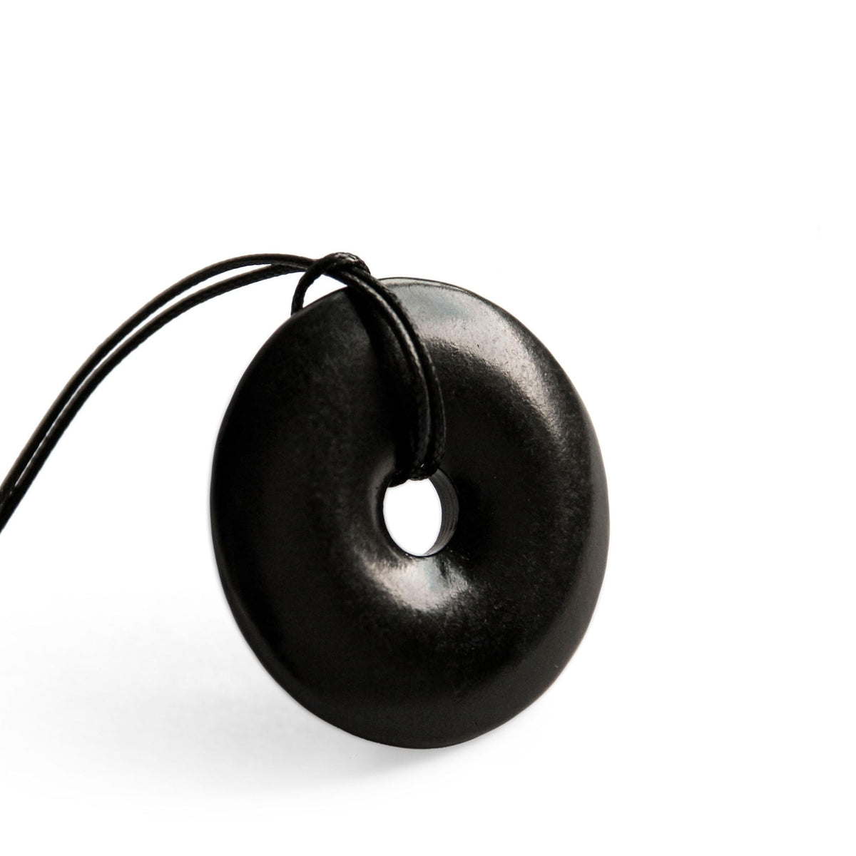 Karelian Heritage shungite protection necklace, front view of doughnut pendant for daily grounding