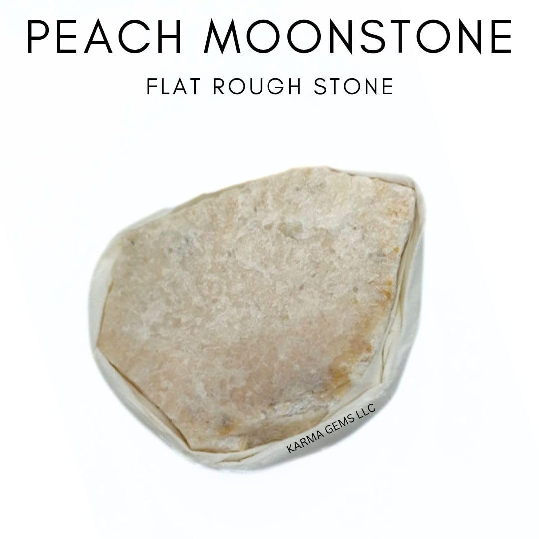 Karma Gems Peach Moonstone flat stone in hand for emotional balance.