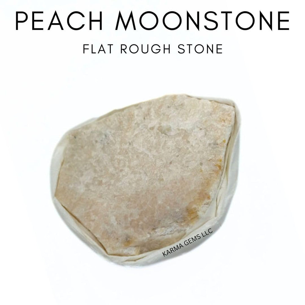 Karma Gems Peach Moonstone flat stone in hand for emotional balance.