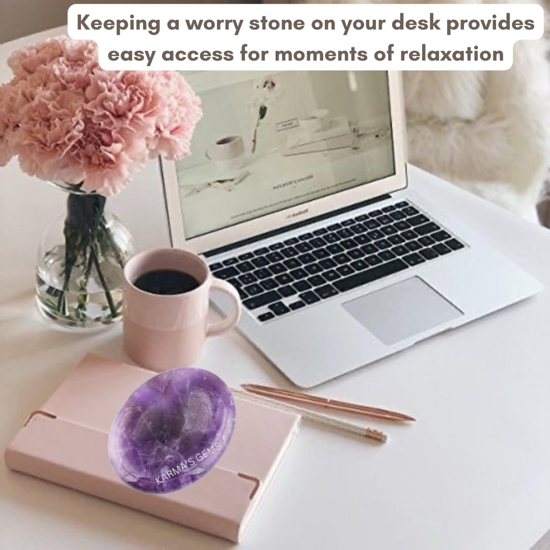 Karma Gems Amethyst worry stone beside candle and plant for mindful ambience