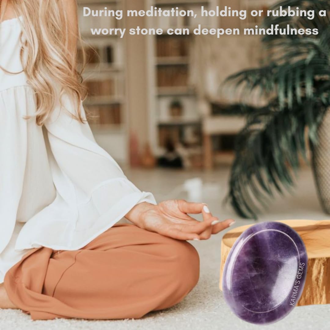 Karma Gems Amethyst worry stone in use between fingers for anxiety relief