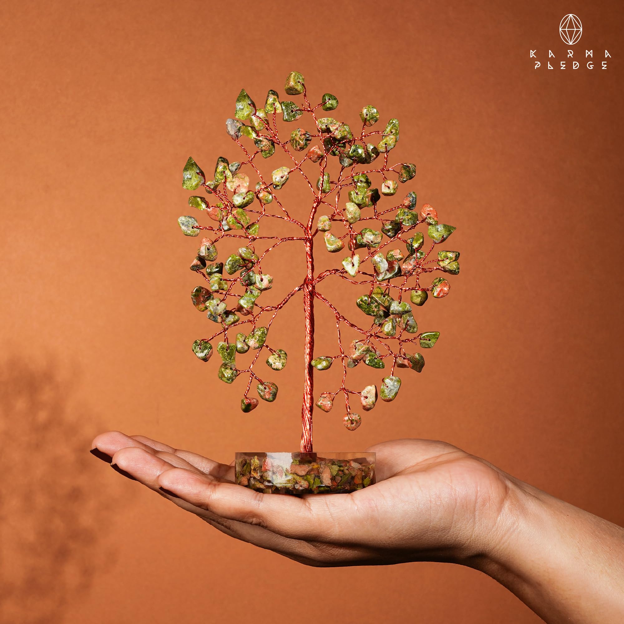 KARMAPLEDGE 100 crystal beads on a bonsai-style crystal tree show craftsmanship.