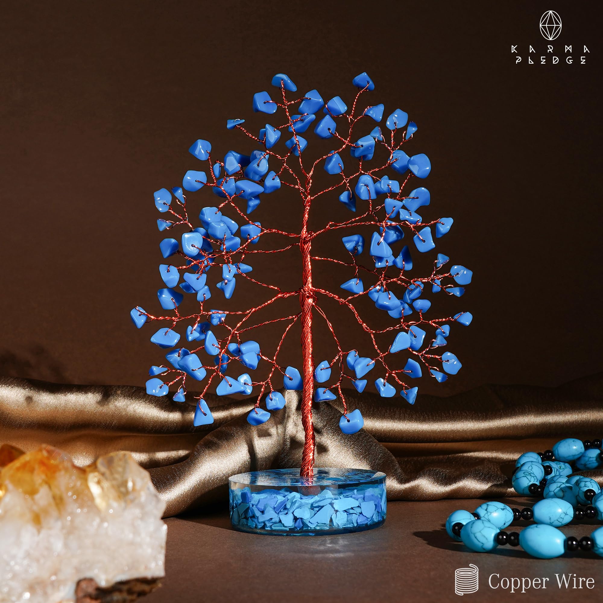 KARMAPLEDGE crystal tree features 100 beads for rich texture and handcrafted glow.