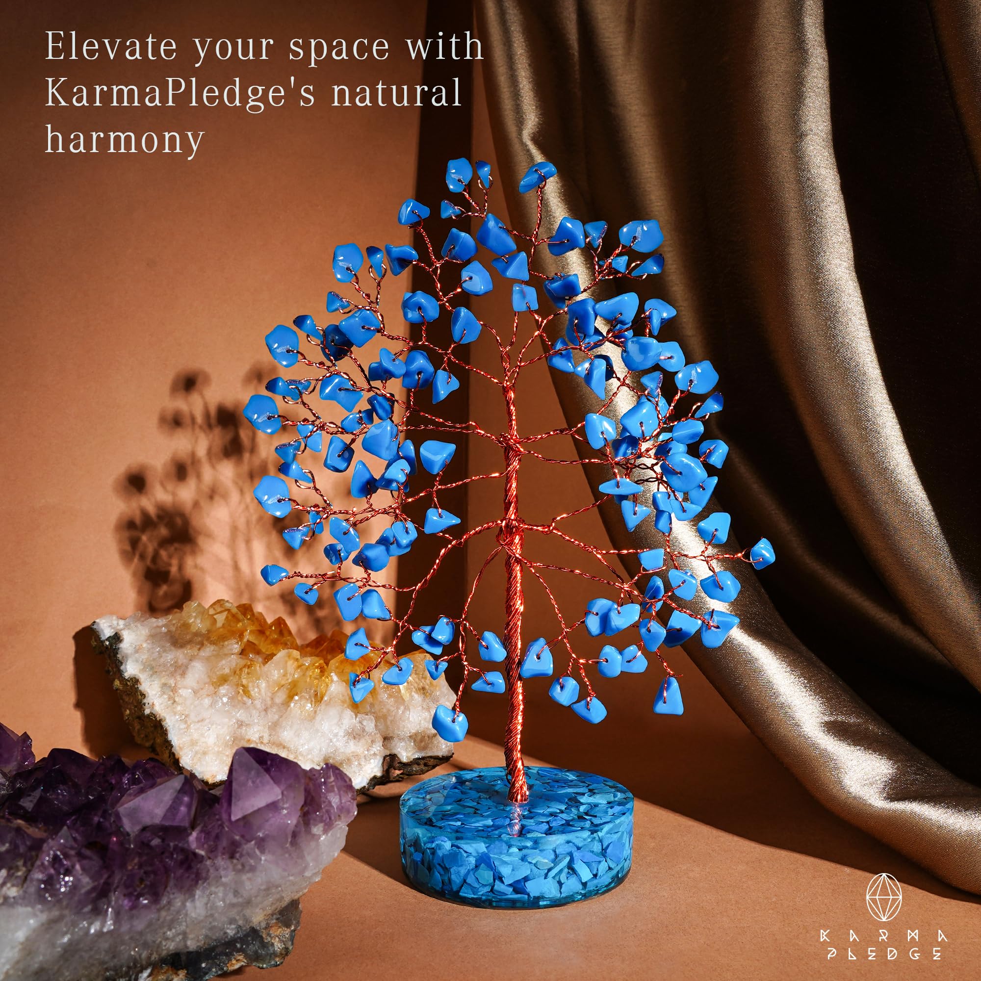KARMAPLEDGE crystal tree orgone base anchors energy and stability on a table.