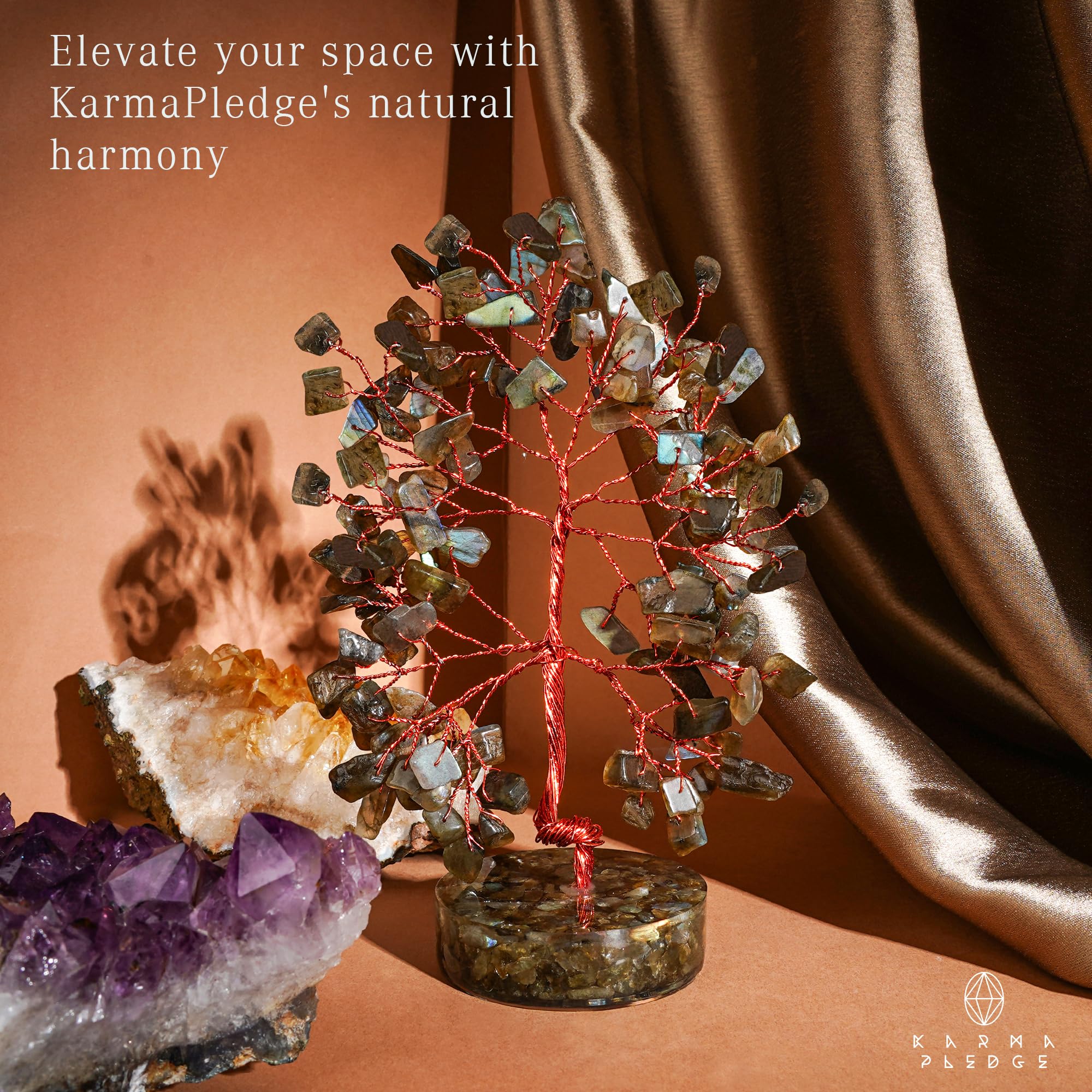 KARMAPLEDGE orgone-base crystal tree anchors its elegant display.