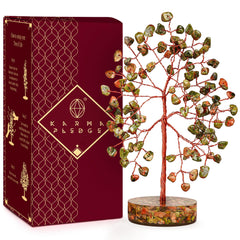 KARMAPLEDGE crystal tree with unakite chakra stones to promote calm on a desk.
