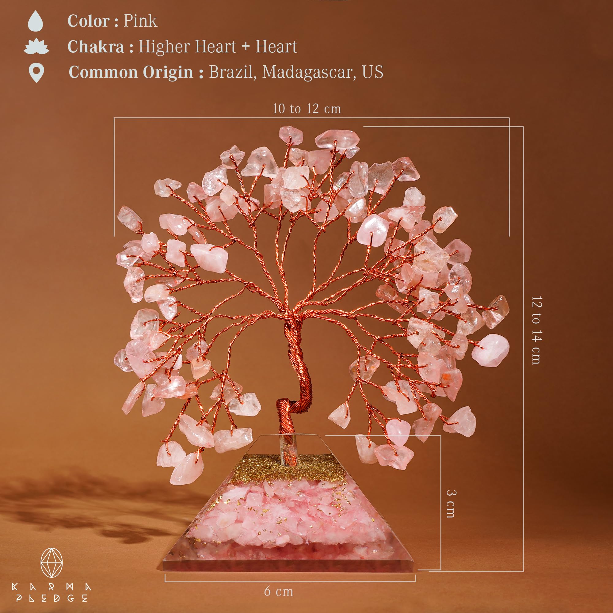 KARMAPLEDGE Rose Quartz Crystal Tree on a desk creates elegant, positive ambience.