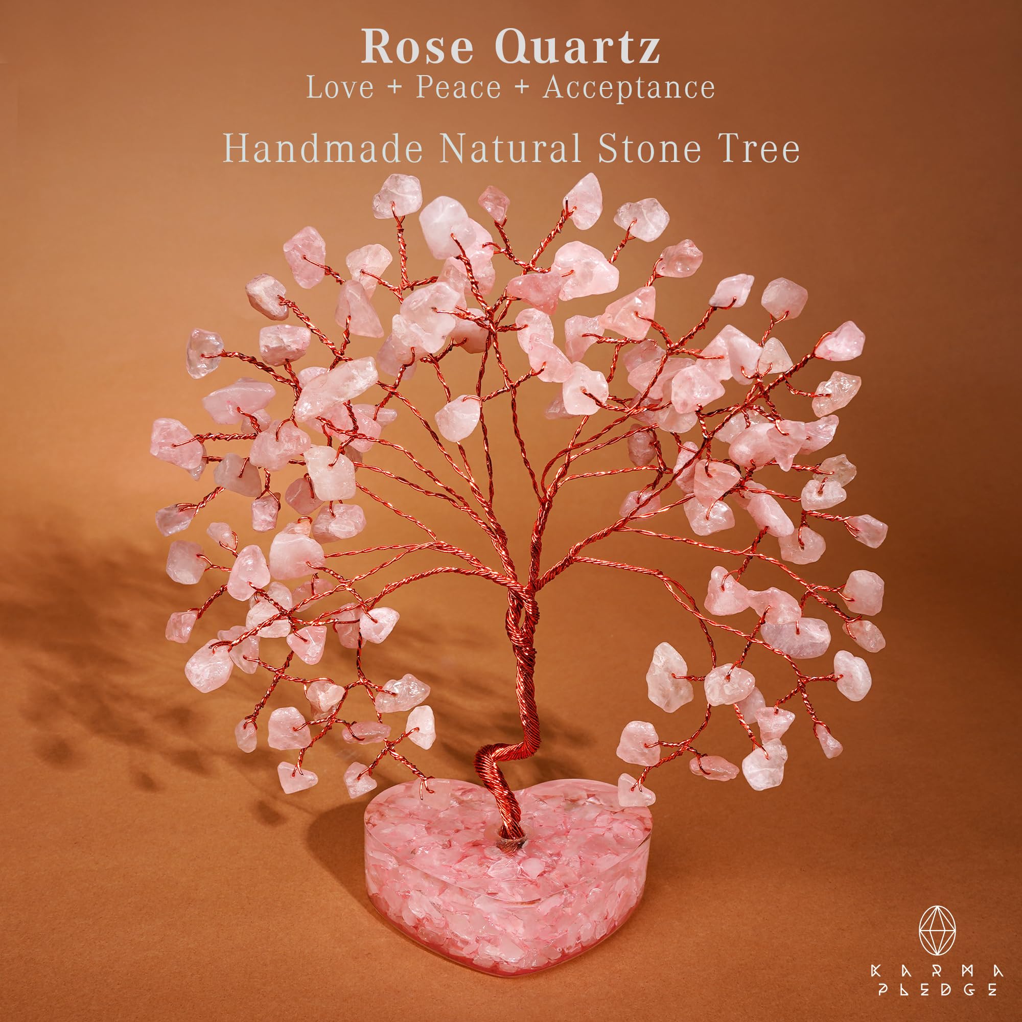 KARMAPLEDGE Rose Quartz Crystal Tree in home office promotes positive vibes.