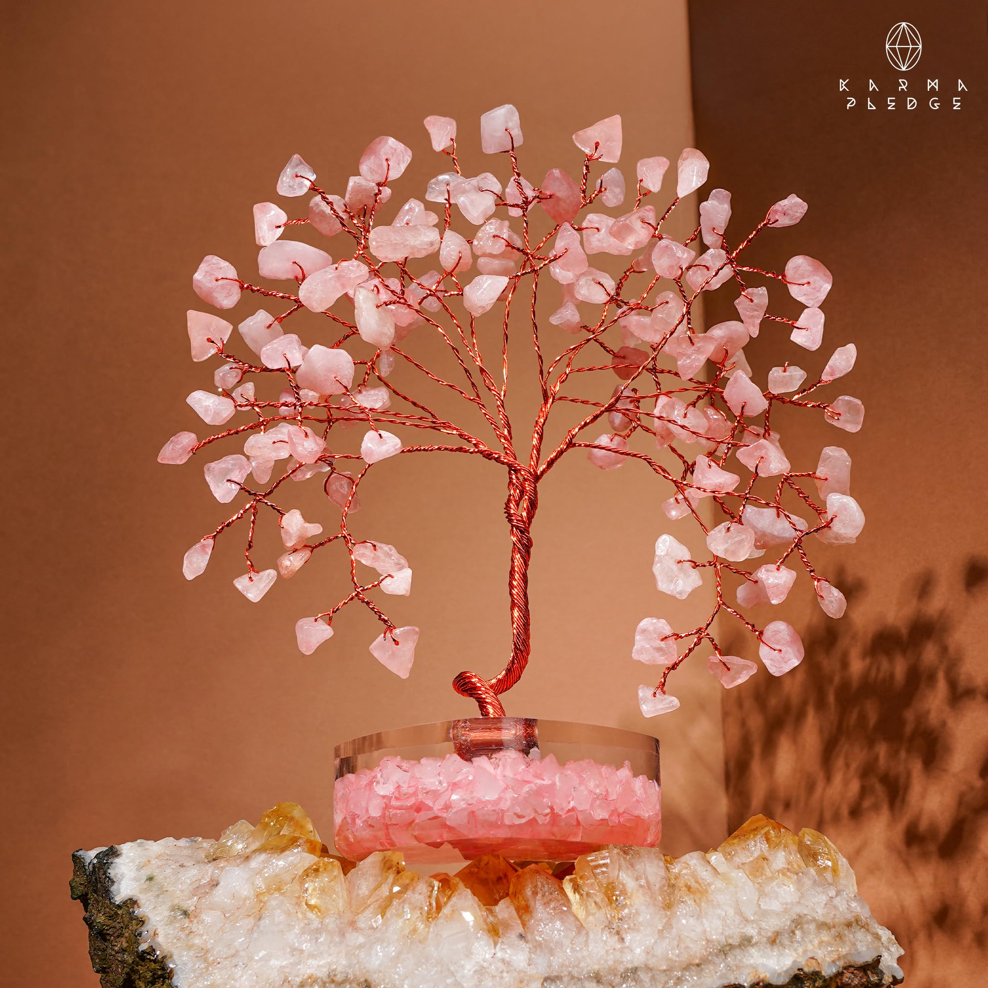 KARMAPLEDGE Rose Quartz Crystal Tree suited for meditation spaces.