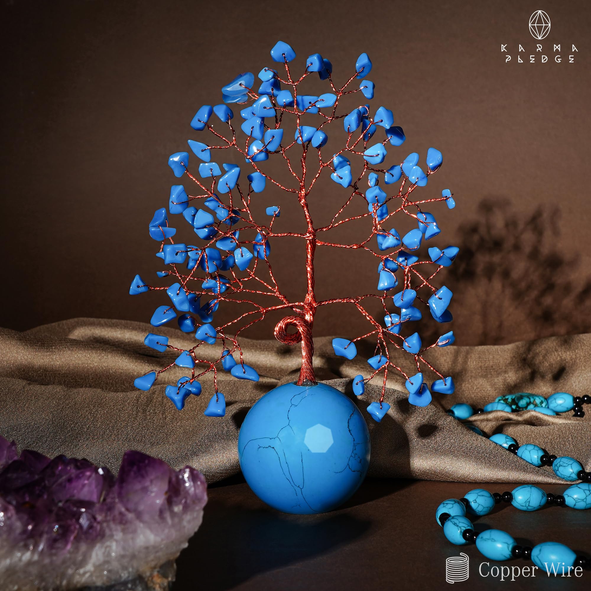 KARMAPLEDGE table top decor shown on a shelf in a living room