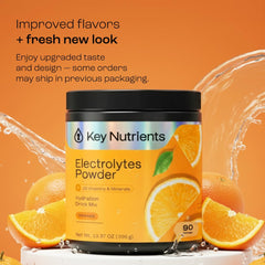 Scoop of KEY NUTRIENTS Tangy Orange powder ready for serving.