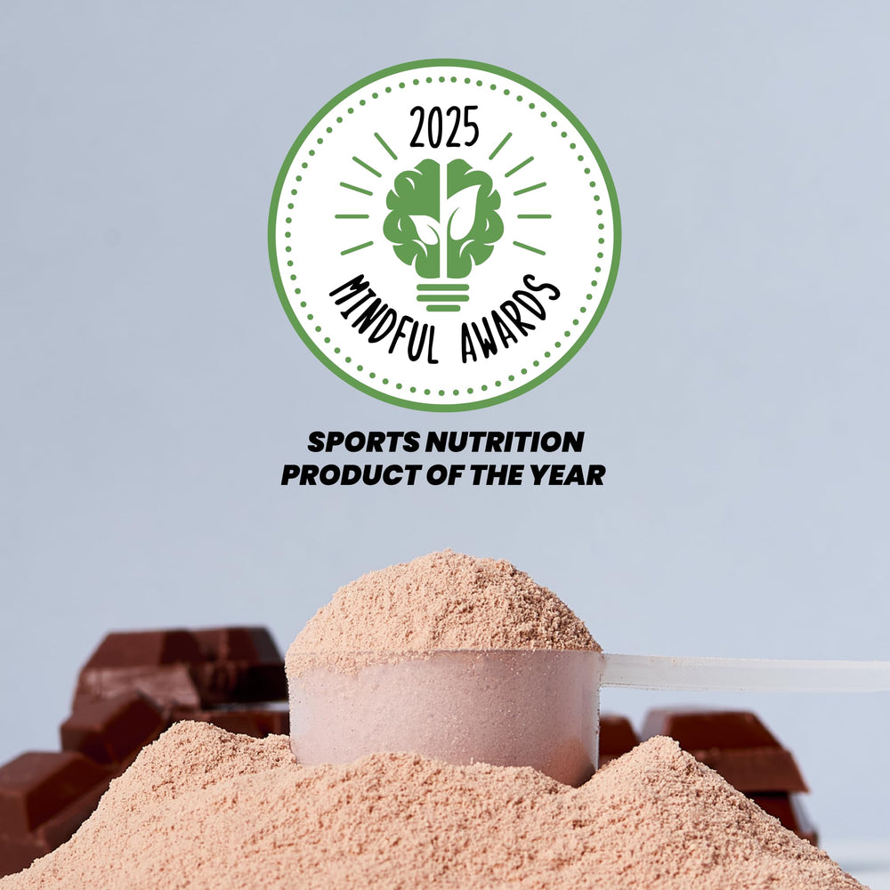 Kick Whey Protein Chocolate shake in tall glass shows easy mixability.