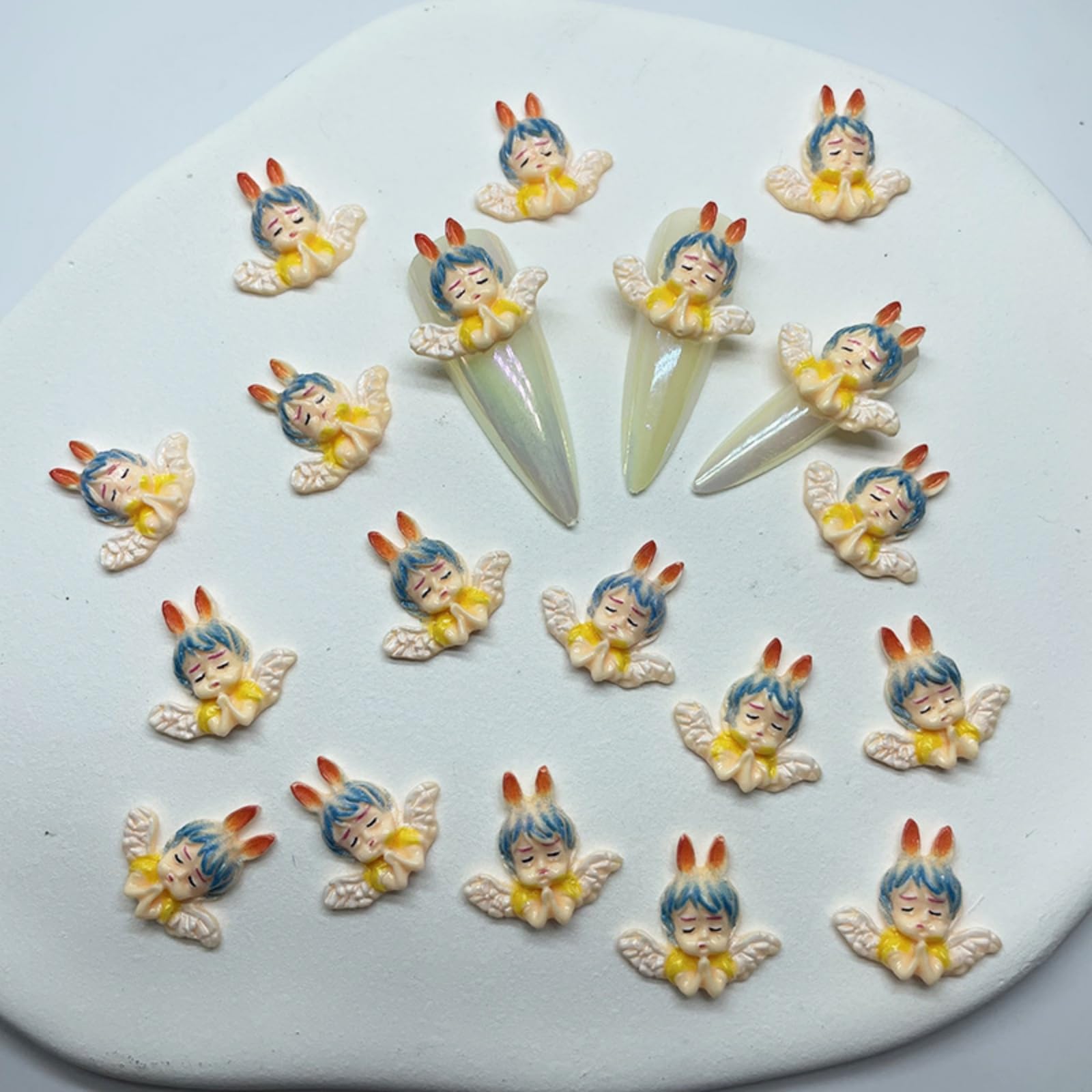 KINGVELLY 3D angel baby nail charm set viewed together for DIY projects.