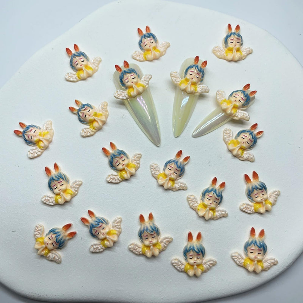 KINGVELLY 3D angel baby nail charm set viewed together for DIY projects.