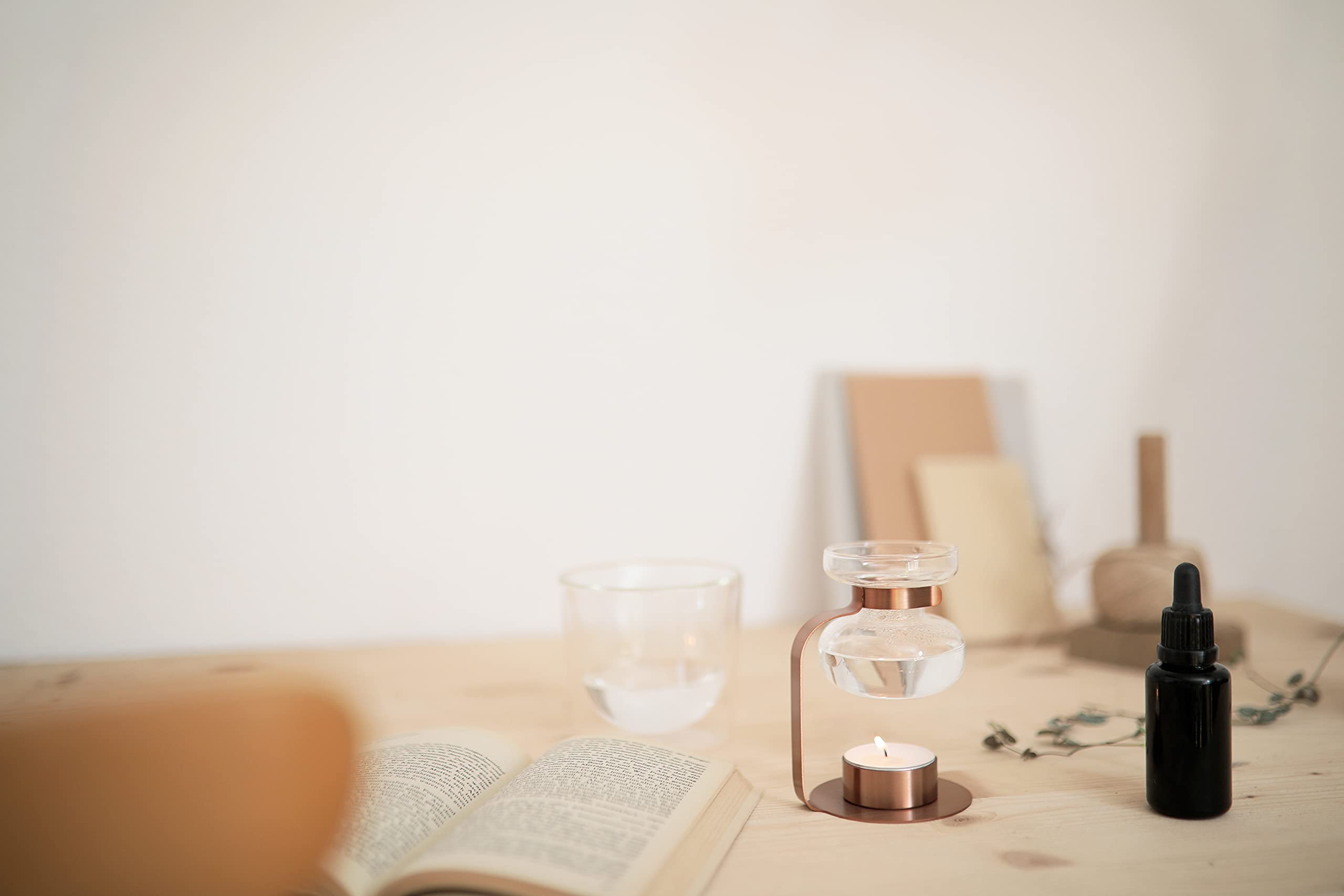 Kinto Aroma Oil Warmer on desk creates cozy ambience for evenings.