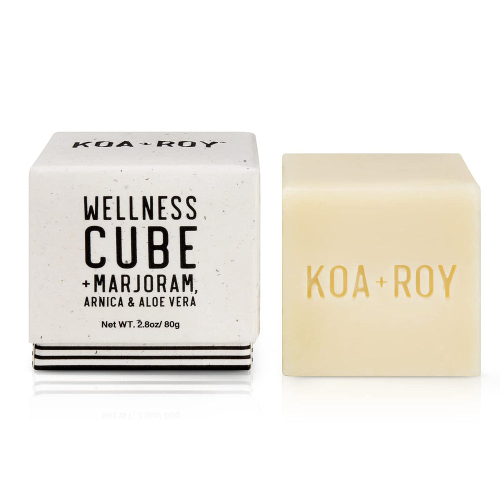 KOA ROY Wellness Cube applied on shoulder for soothing relief.