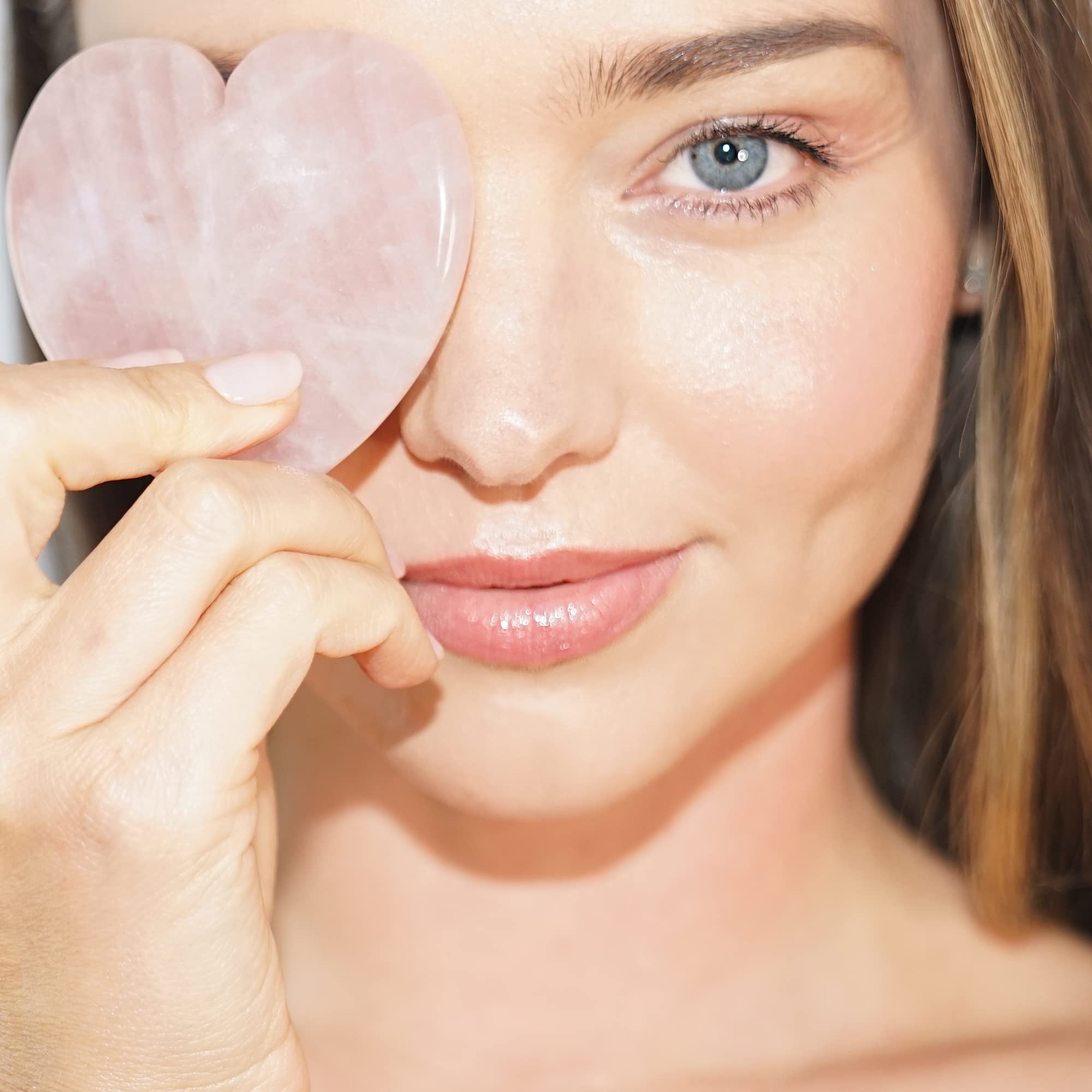 KORA Organics Rose Quartz Heart Sculptor for neck and chin massage.