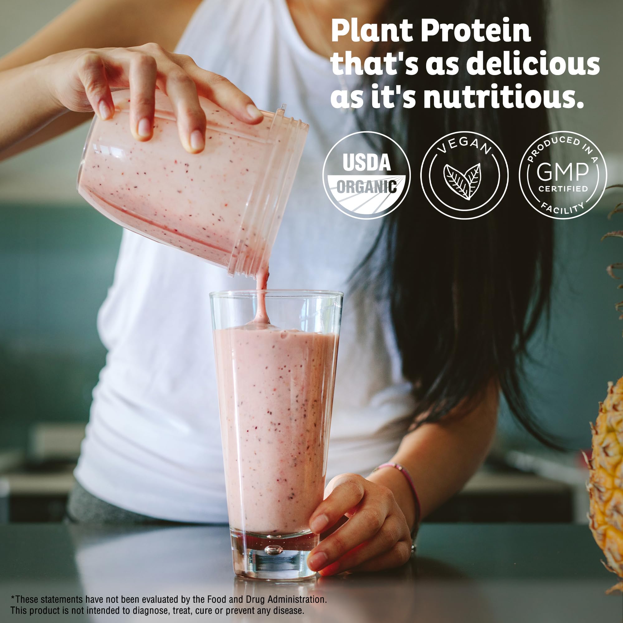 Pouring a KOS pea protein shake into a glass demonstrates smooth mixability.
