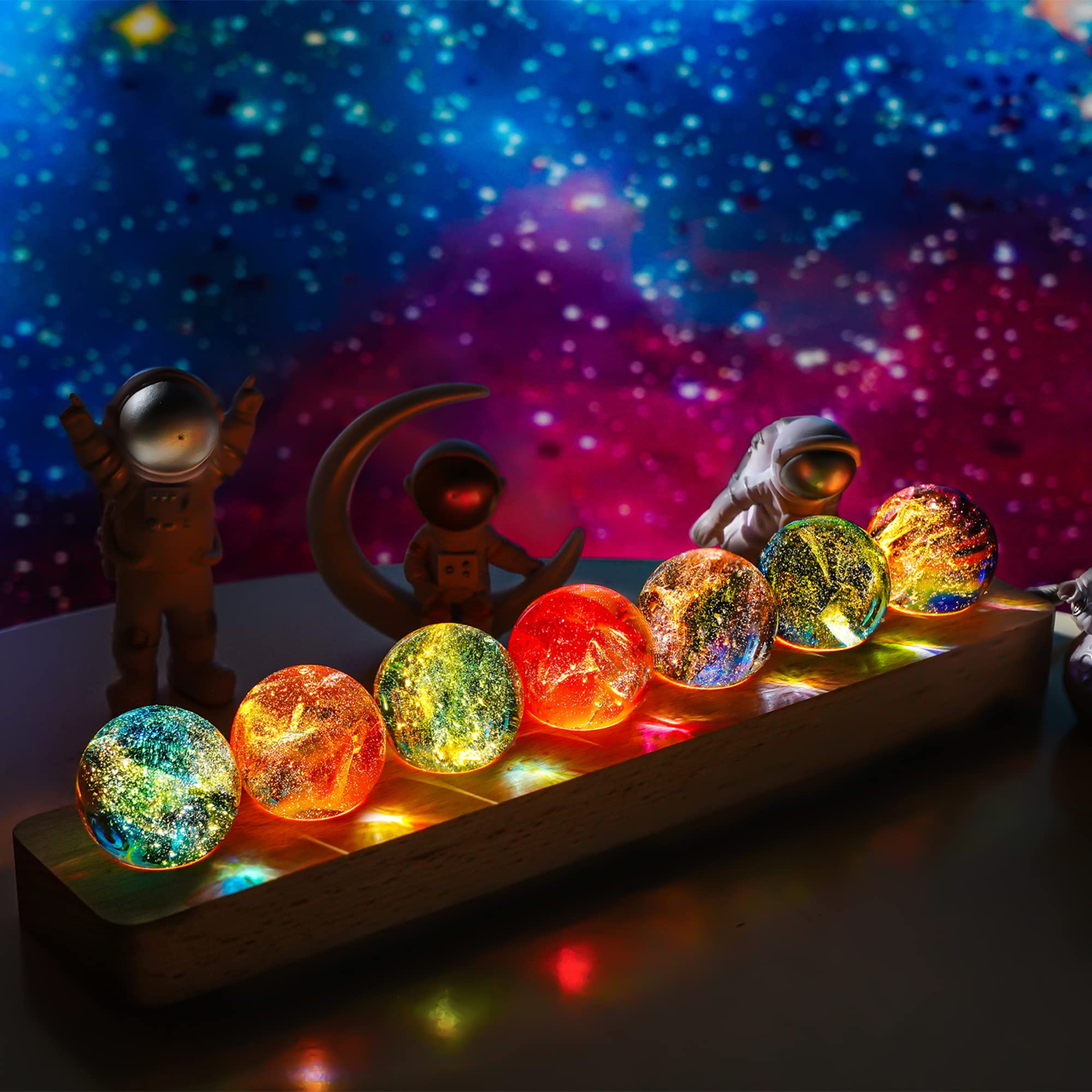 KRISININE 7 chakra spheres on LED stand create a calming meditation ambiance.