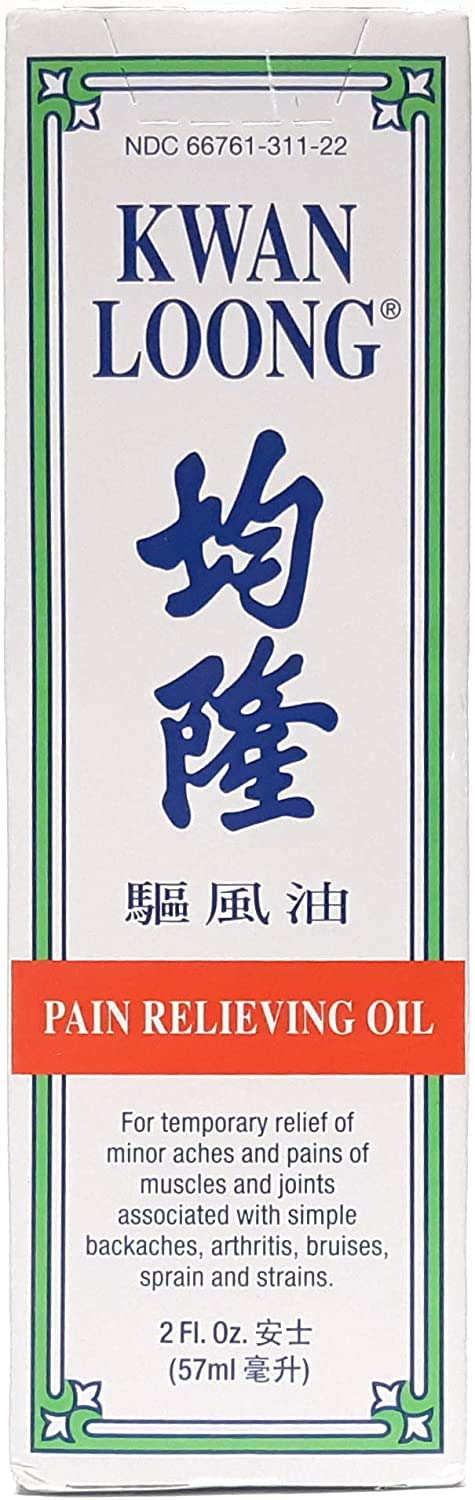 Applying Kwan Loong menthol massage oil on the shoulder for targeted comfort and relaxation.