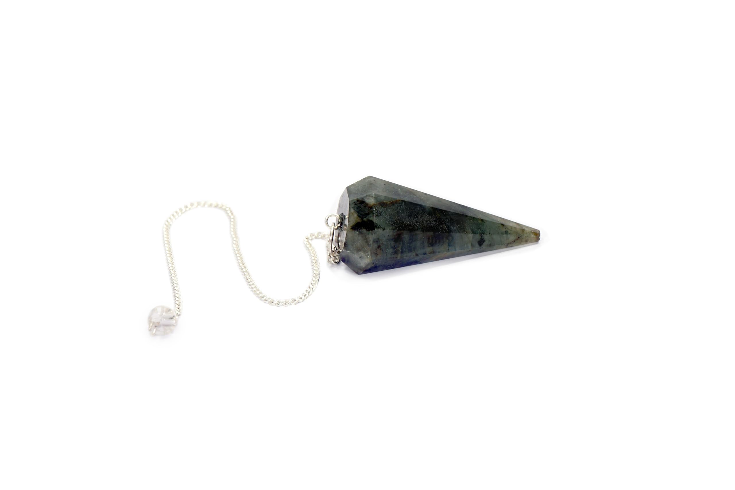 L Pedra & Crystal balanced pendulum aiding mindful divination sessions.