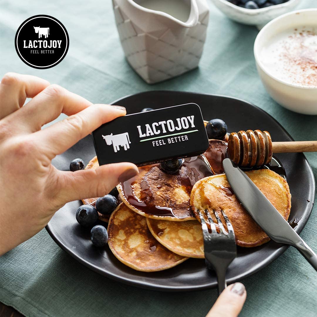 Lifestyle scene showing a social event with a dairy-friendly meal and LactoJoy.