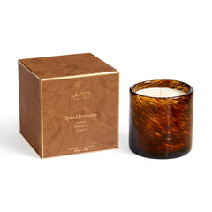 LAFCO New York Holiday Candle in Spiced Pomander resting in its frosted glass vessel.
