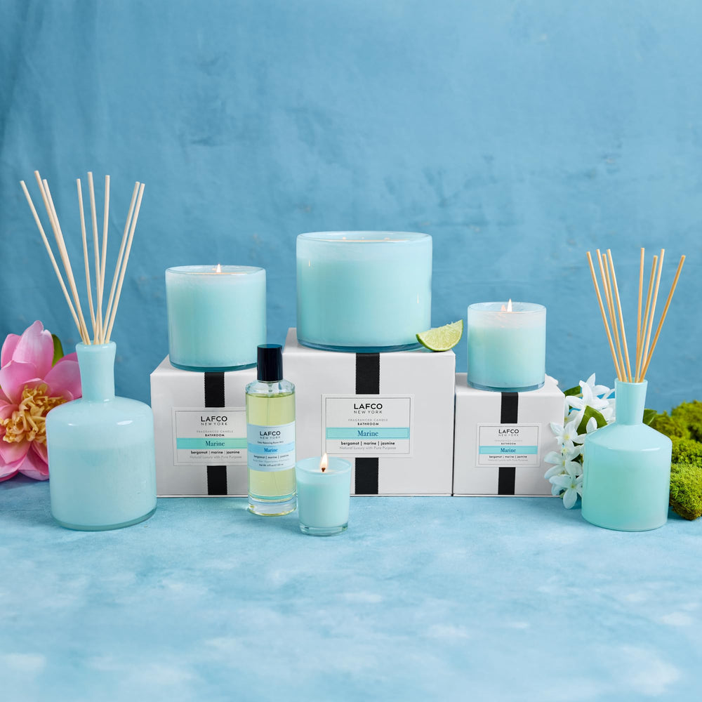 LAFCO New York Signature Marine candle in scene with a soft glow enhances ambiance.